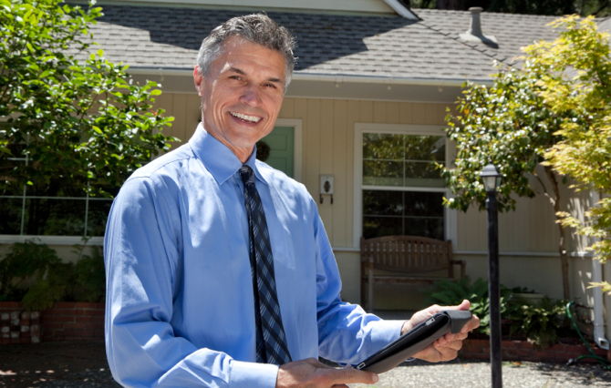 Real Estate Agent with an iPad Real Estate Agent with an iPad